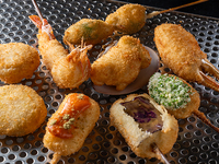 Table seating only (minimum 3 people) Special selection of 18 skewers: 8000 yen set (live shrimp, Wagyu beef, local clams, seasonal meat, fish, and vegetable skewers)
