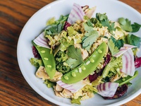 Kale and brown rice salad with tuna confit, snap peas, sliced beets and basil lemon dressing