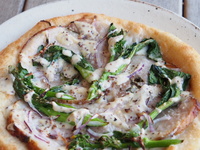 "Pizza Bianca with Porchetta and Rapeseed Blossoms"